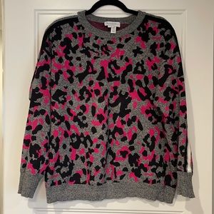 Leopard print sweater with stripes on arms